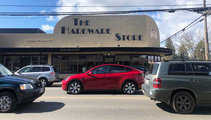 Cars passing by in front of The Hardware Store Restaurant