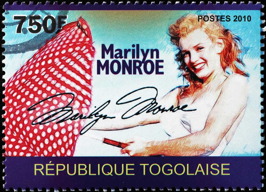 Marilyn Monroe with her signature on a postage stamp
