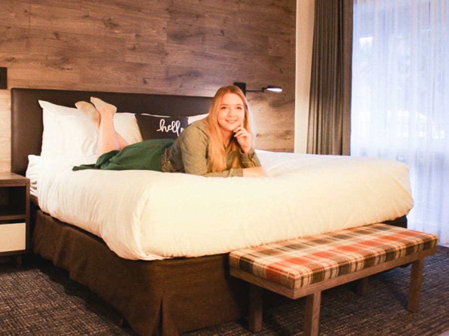 The author posing for a picture while on bed in The Hotel on Ponal