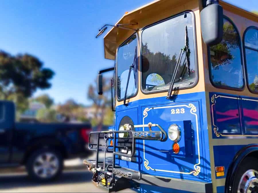 View of the front of a blue Laguna Beach Trolley