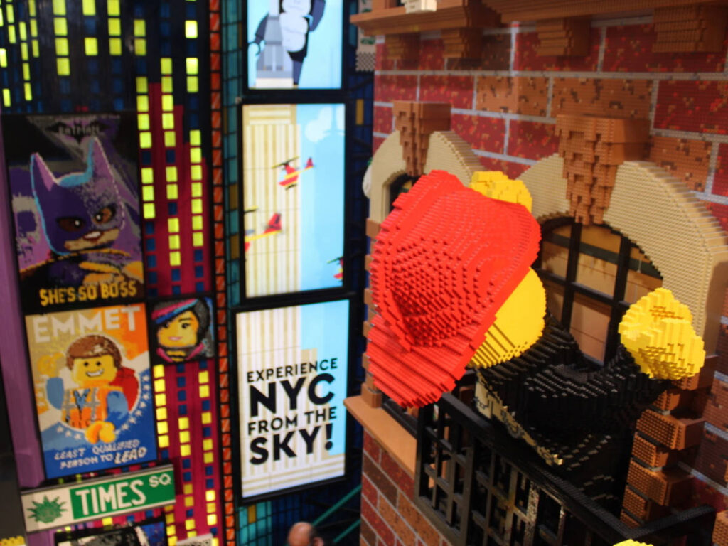 A lego display and posters inside The Lego Store