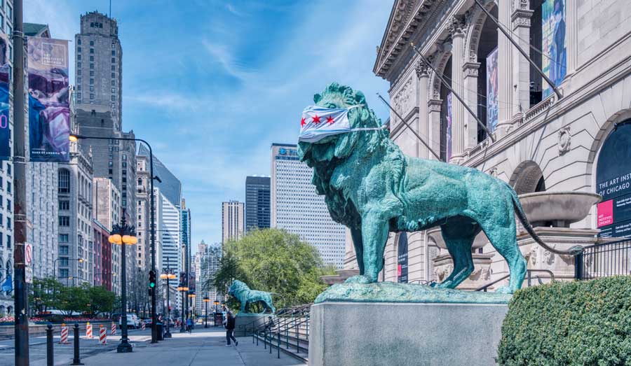 The Lions outside the Art Institute wearing a mask