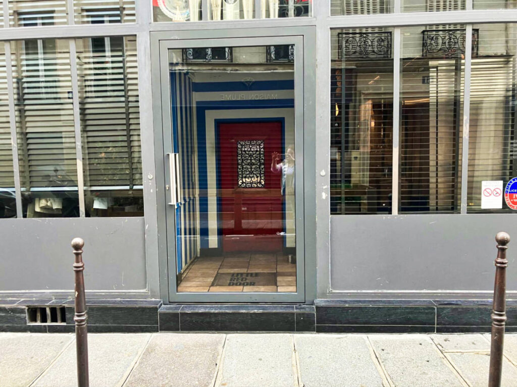 Entrance view of the Little Red Door in Paris