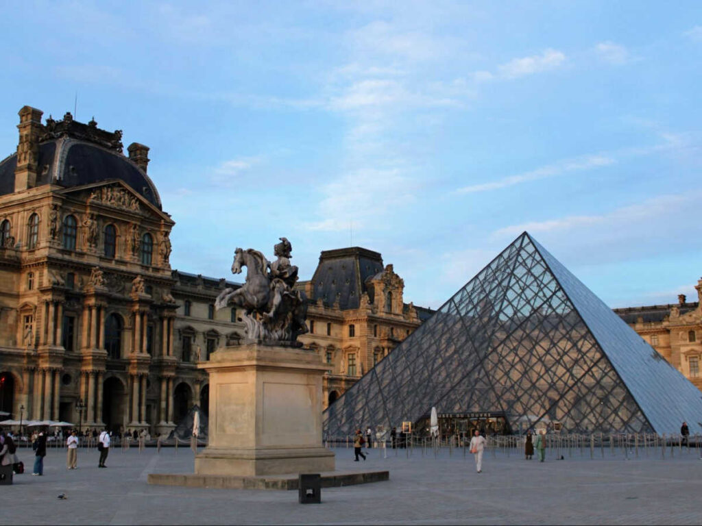 View of The Louvre Museum at sunset