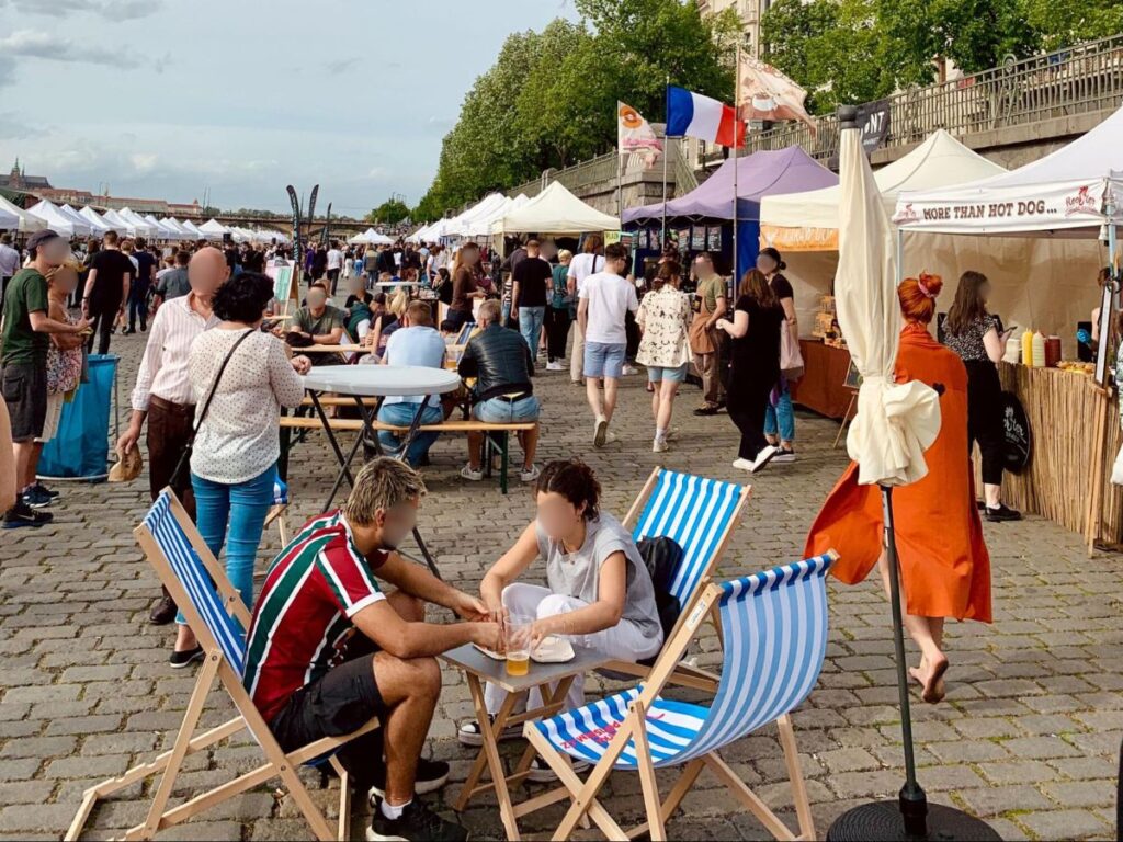 People exploring and enjoying some food and drink at The Mint Market