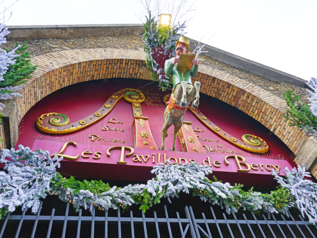 View of the carnival-themed signage of The Musée des Arts Forains
