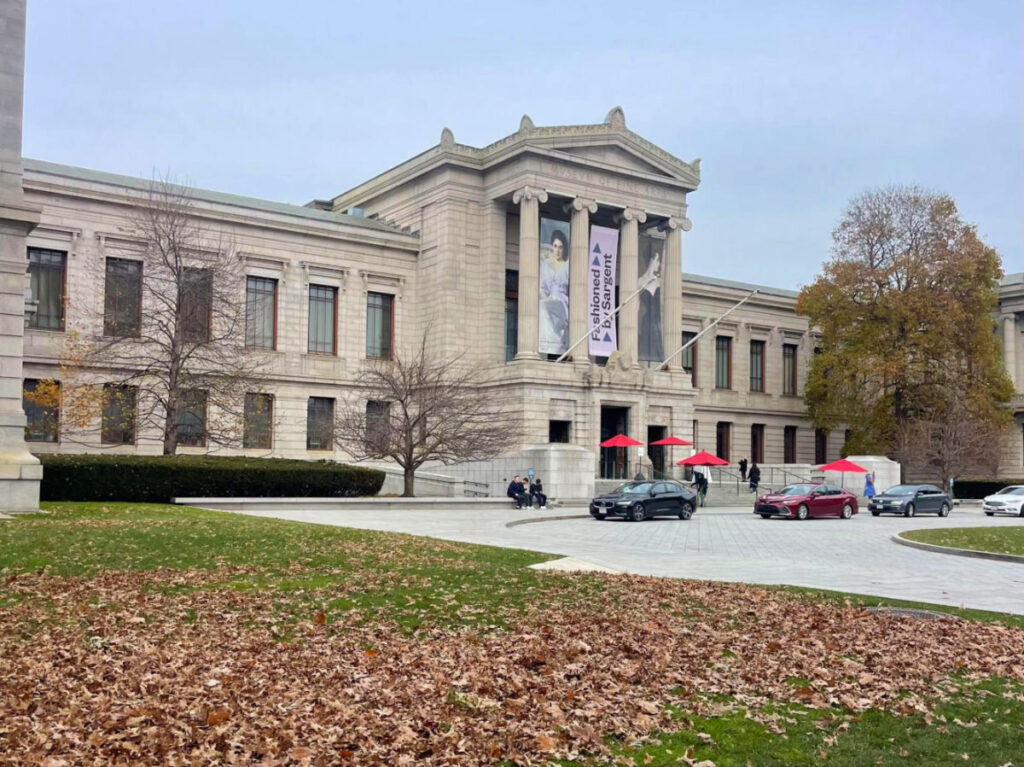 Exterior view of the Museum of Fine Arts Boston with leaves fallen on the ground