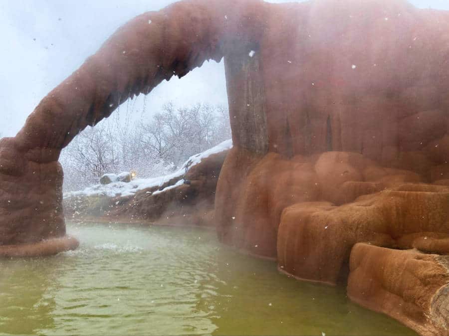 View of the steaming hot spring in winter at the Mystic Hot Springs