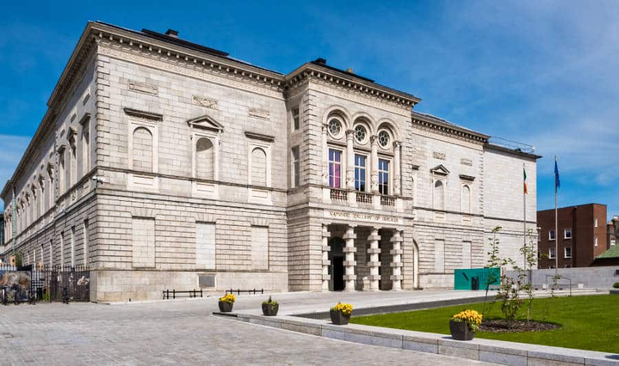 Exterior view of The National Gallery of Ireland and the beautiful flowers along the pathway