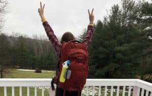 Sky carrying her Osprey Farpoint 55
