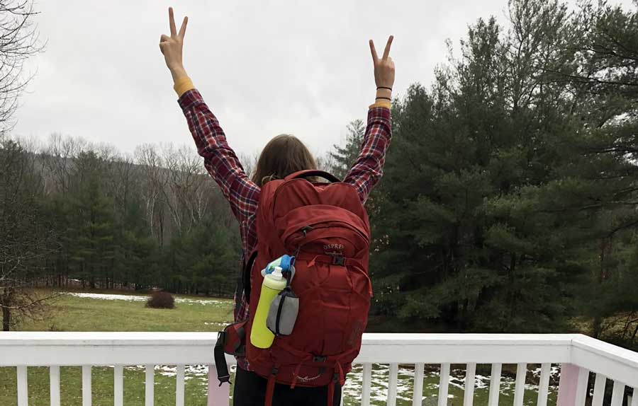 The author carrying her Osprey Farpoint 55