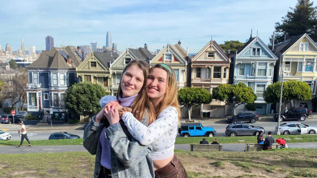 The author, Laura McFarland with her friend and the Painted Ladies on their background