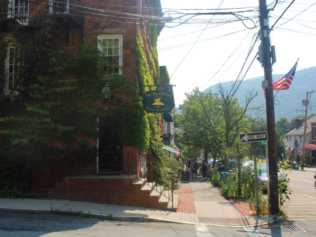 View of the greenery covered building of The Pig Hill Inn