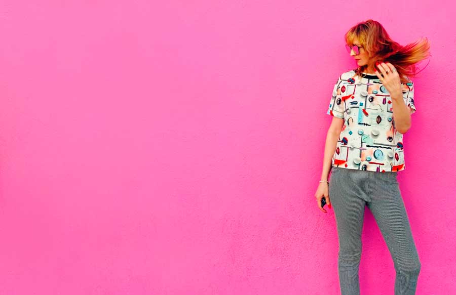 The author posing for a photo on The Pink Wall