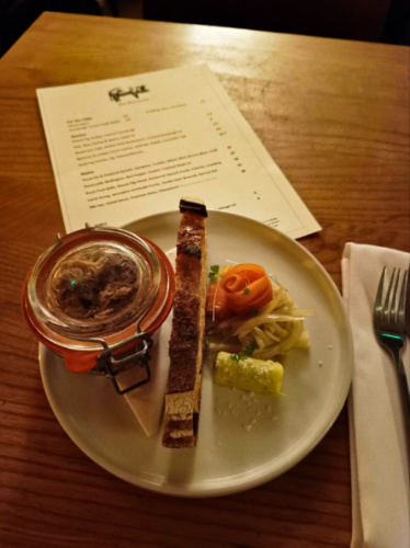 Top view of a plate with bread and vegetable starter from The Potted Pig