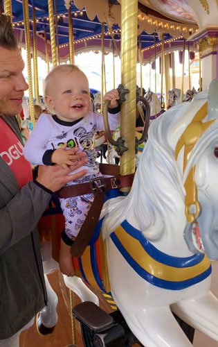 The author's son having fun riding The Prince Charming Regal Carrousel in Disney World Orlando