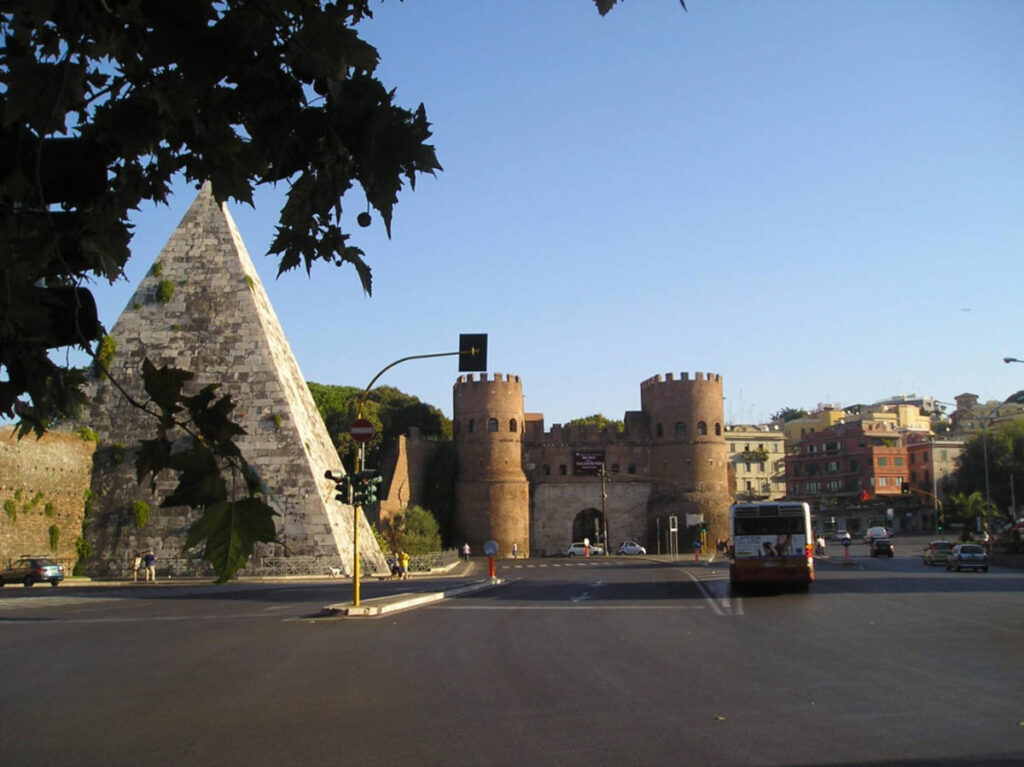 View of The Pyramid of Cestius near the streets in Testaccio