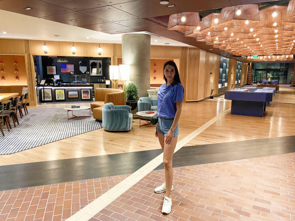 Clara Kesseler standing in the lobby of Denver's The Rally Hotel