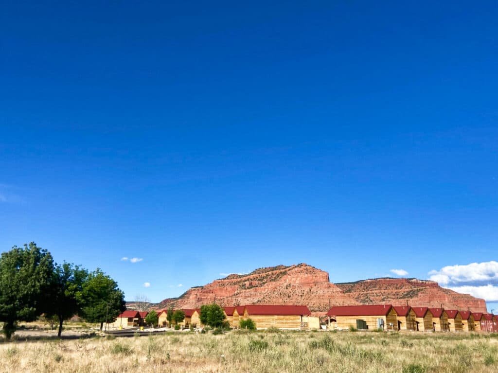 View of The Red Canyon Cabins accommodation with a clear blue sky in the background