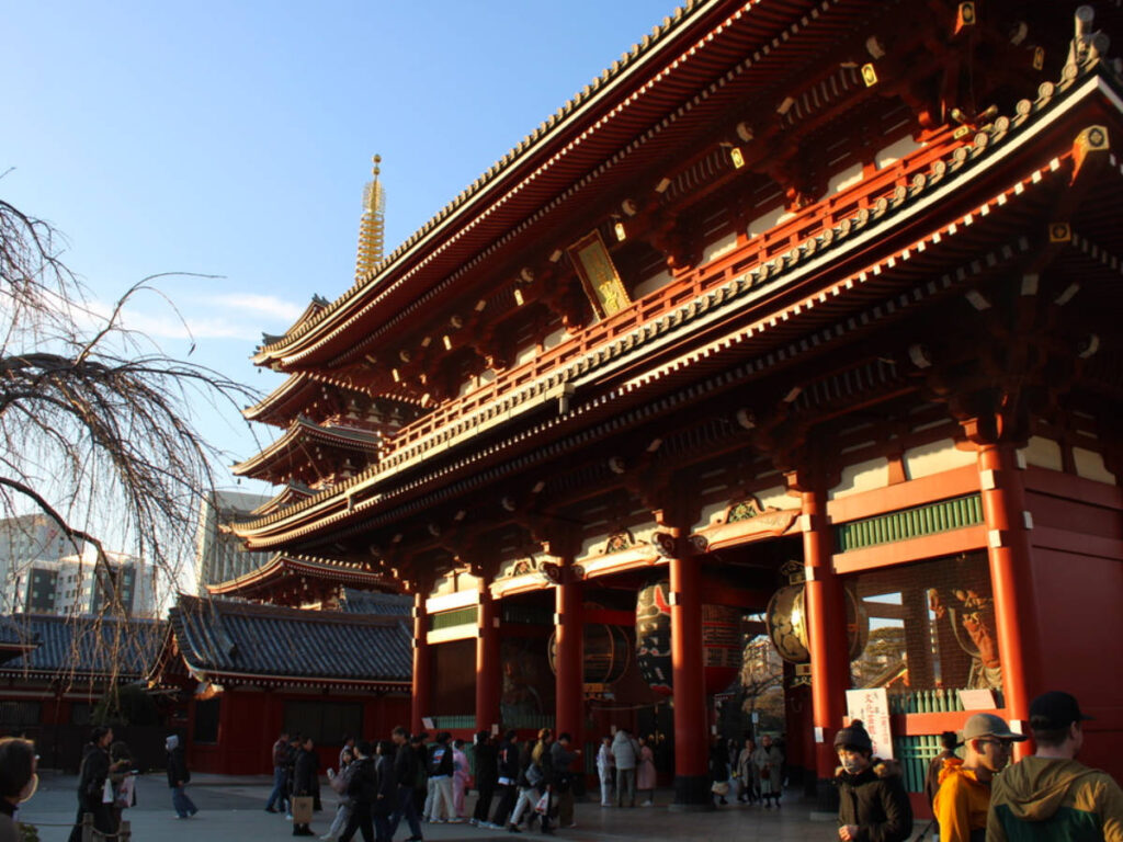 Numerous people walking around the Senso-Ji Temple