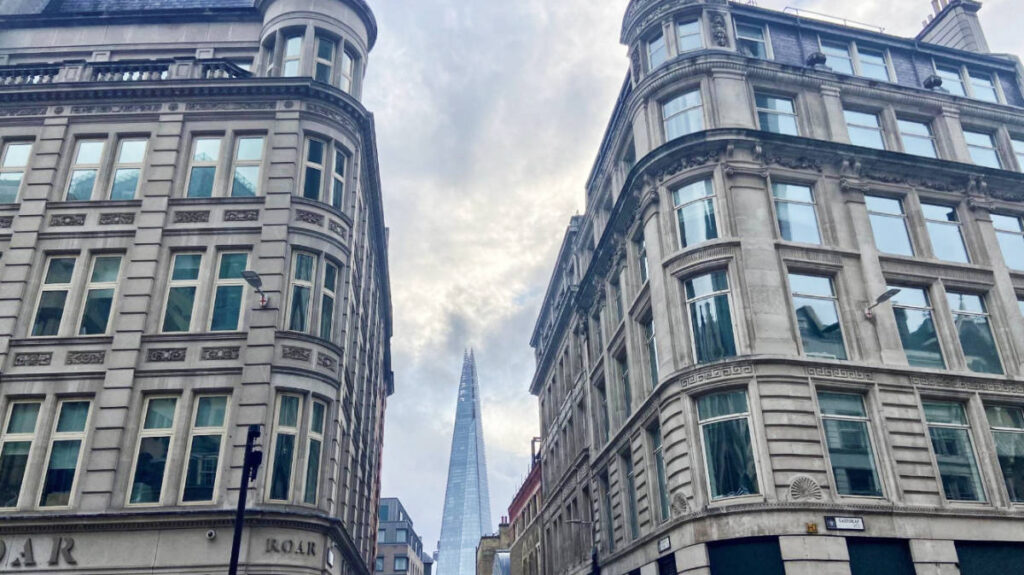 The Shard skyscraper from afar between two buildings