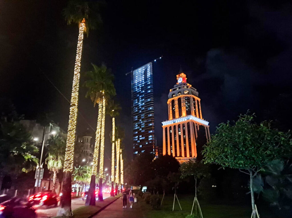 Exterior view of The Sheraton Batumi and the holiday lights around the trees