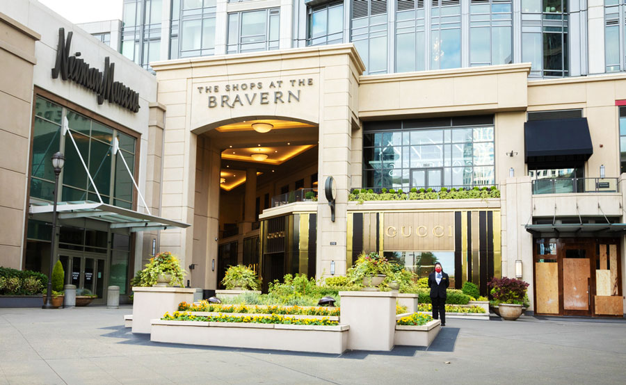 View of The Shops at The Bravern on the outside with a lady guard