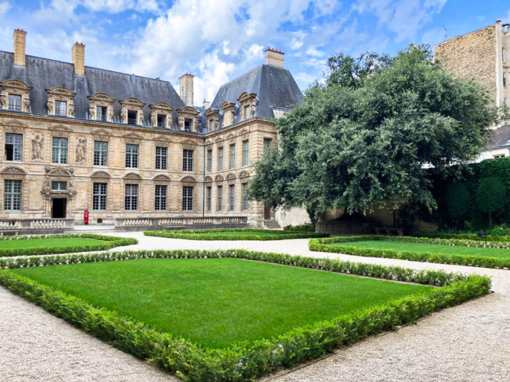 View of the exterior and greenery at the Hôtel de Sully