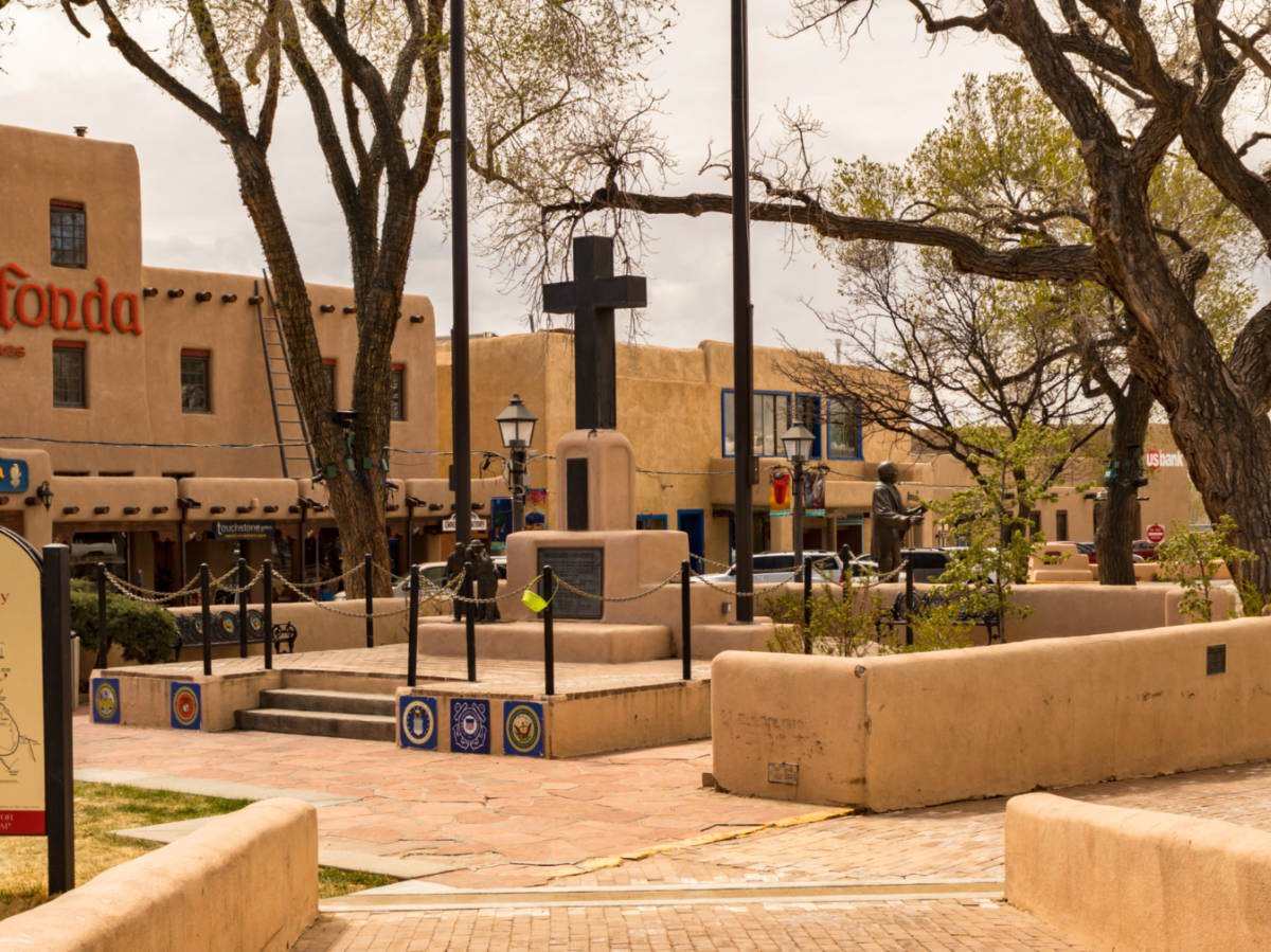 Exterior view of the Taos Plaza surrounded by restaurants, shops and hotel