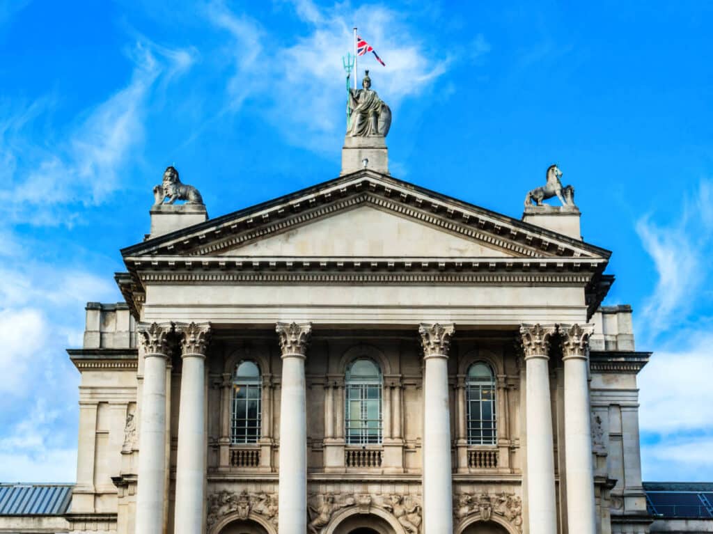 View of the intricate detail on the exterior of The Tate Britain with a clear blue sky in the background