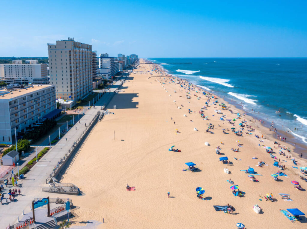 Overlooking view of the oceanfront skyline and the beachgoers along the shoreline