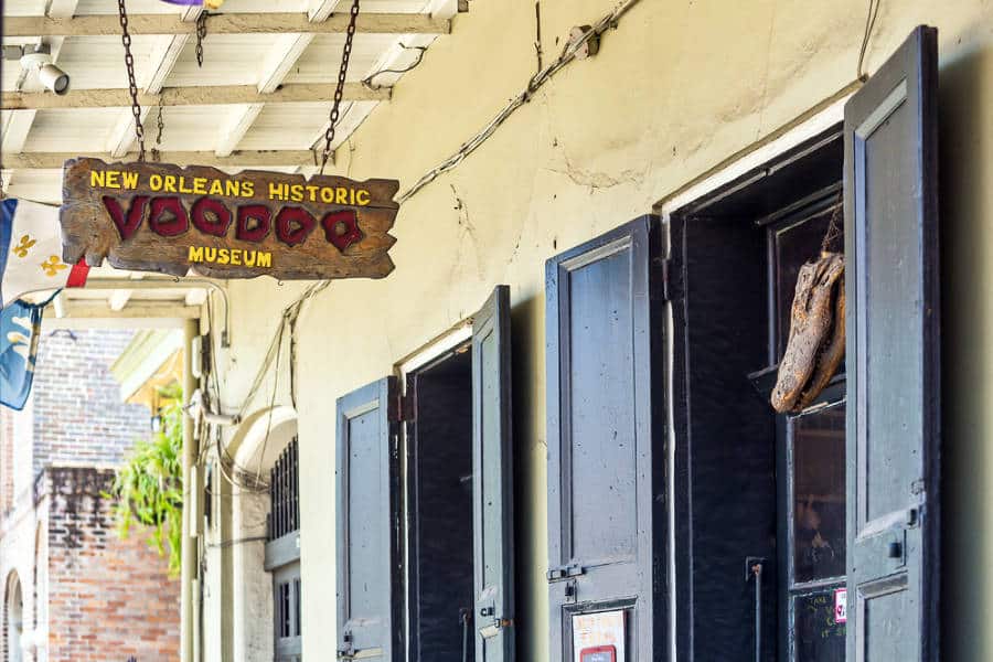 Hanging wooden signage of The Voodoo Museum