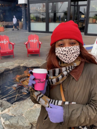 The author, Alexandria Taylor holding a cup of drink in The Wharf