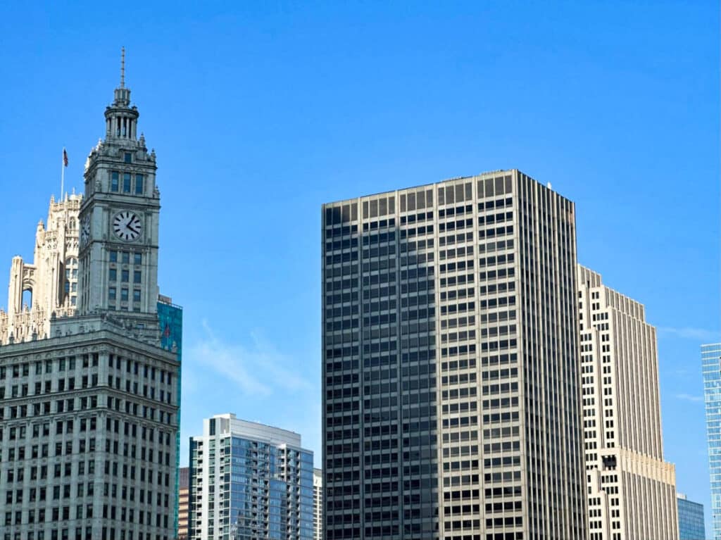 View of the Wrigley Building and the Tribune Tower with a blue sky in the background