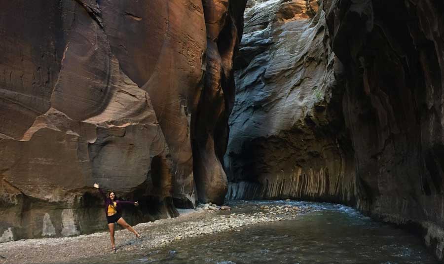 The author posing for a photo at the The Zion Narrows