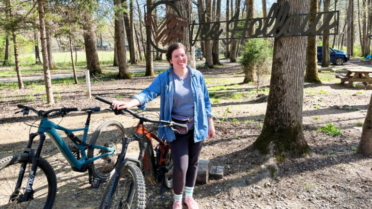 The author Elizabeth Demolat posing with the bicycles in Vee Hollow