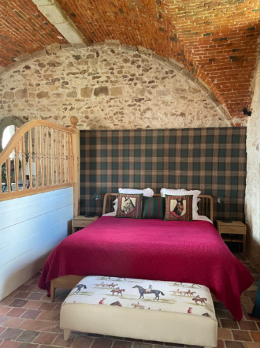 Bed at Château de Fleury with horse pillow