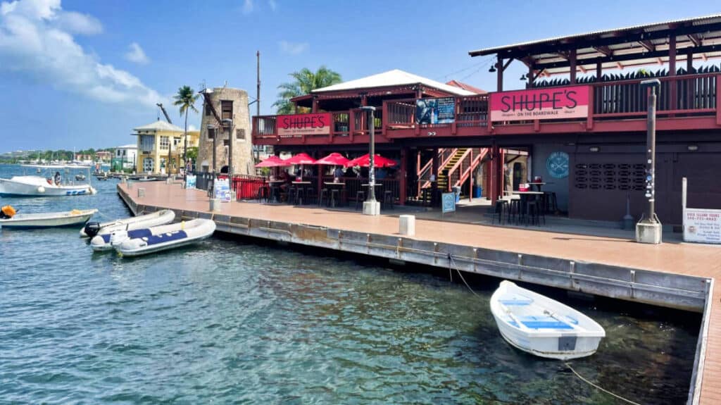 View of the shops and boats docked near the boardwalk in Christiansted