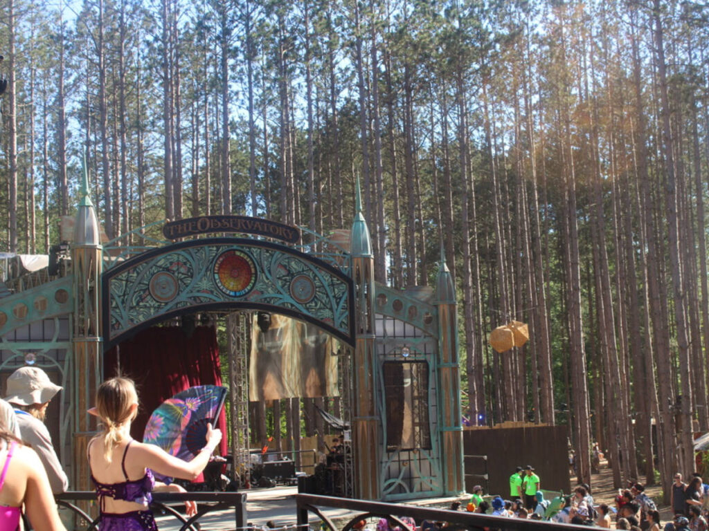 View of The observatory at Electric Forest surrounded by many trees