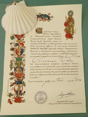 A document with a seashell on top, symbolizing the Camino