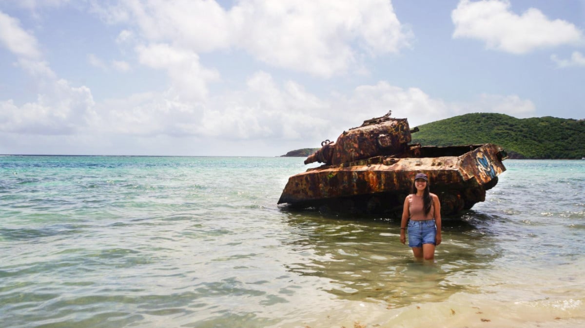 The author, Vanessa Ramos with the military tank in Flamenco Beach, one of the best things to do in Culebra Puerto Rico