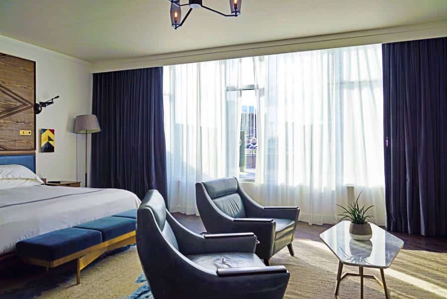 View inside the hotel room with seating area in Thompson Hotel
