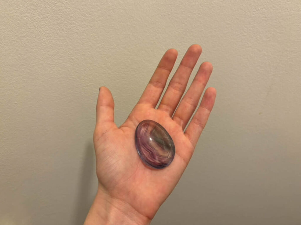 Thumb crystal on a palm