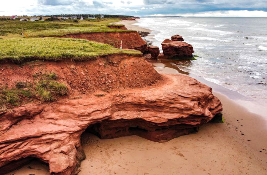 An aerial view of Thunder Cove Beach and Teacup rock in PEI