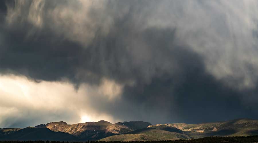 Thunderstorm forming over a mountain