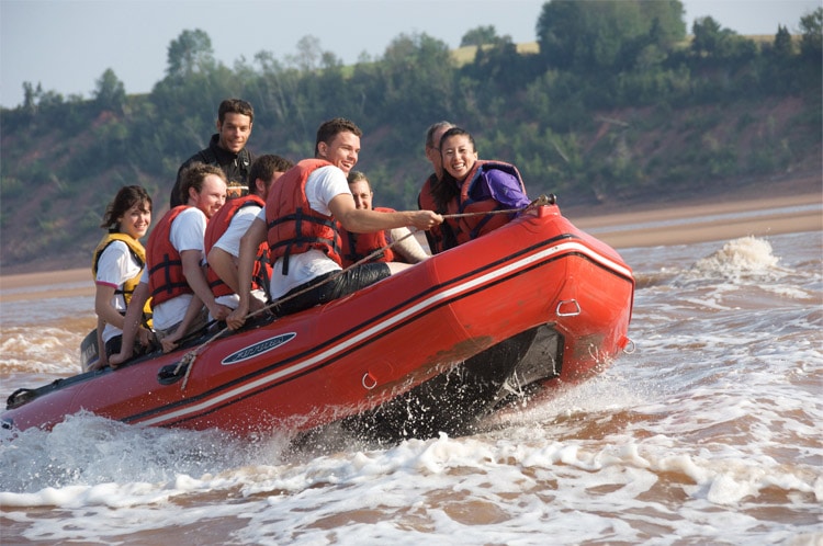 Several people in a raft enjoying tidal bore rafting