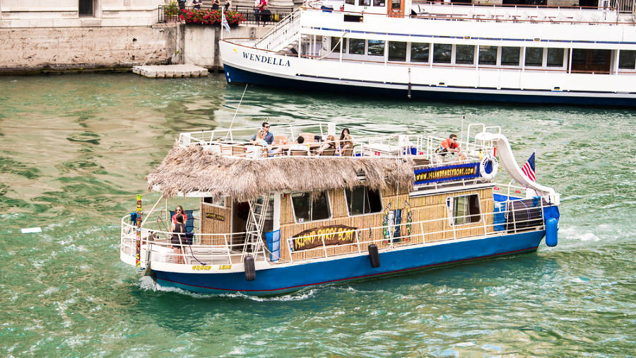 A tiki-themed Island Party Boat sailing on the Chicago River