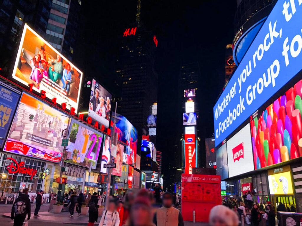 View of the colorful LEDs around and the bustling Times Square at night