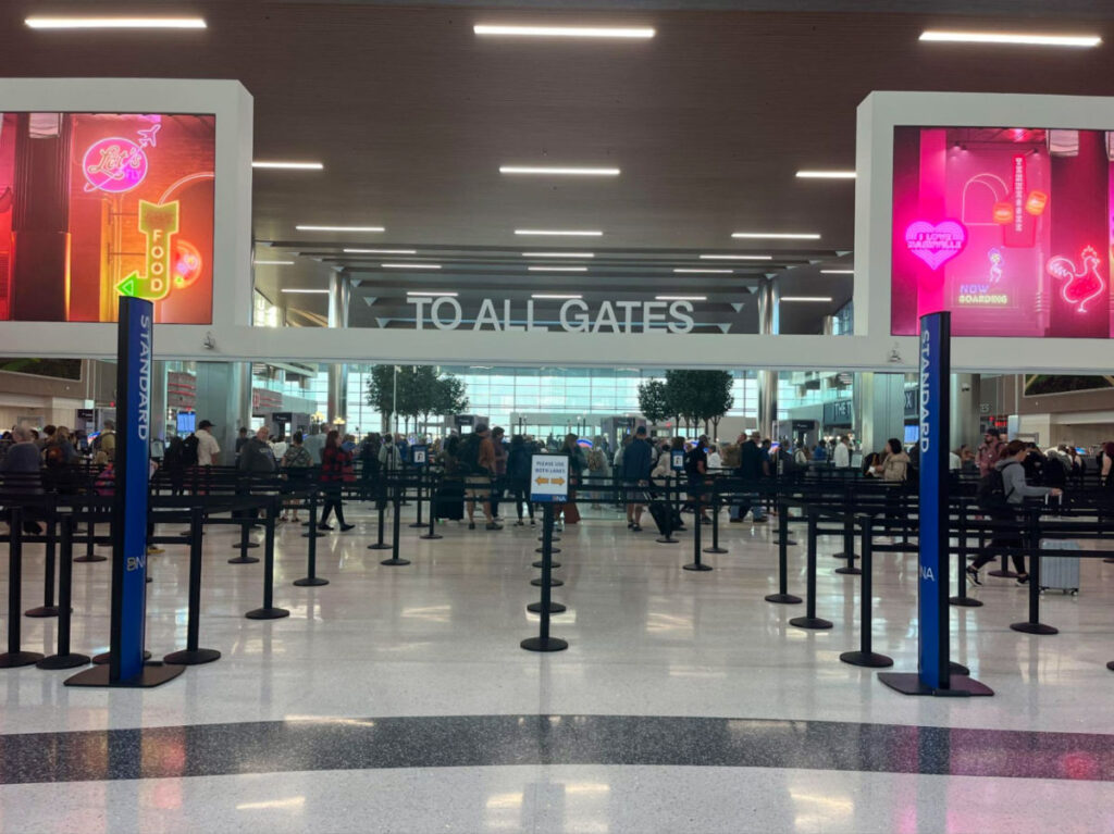 People falling in line to check in counters at Nashville International Airport