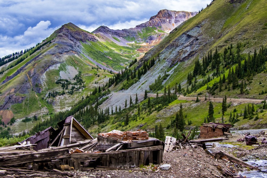 Ruins of the buildings below the mountains in the ghost town of Tomboy